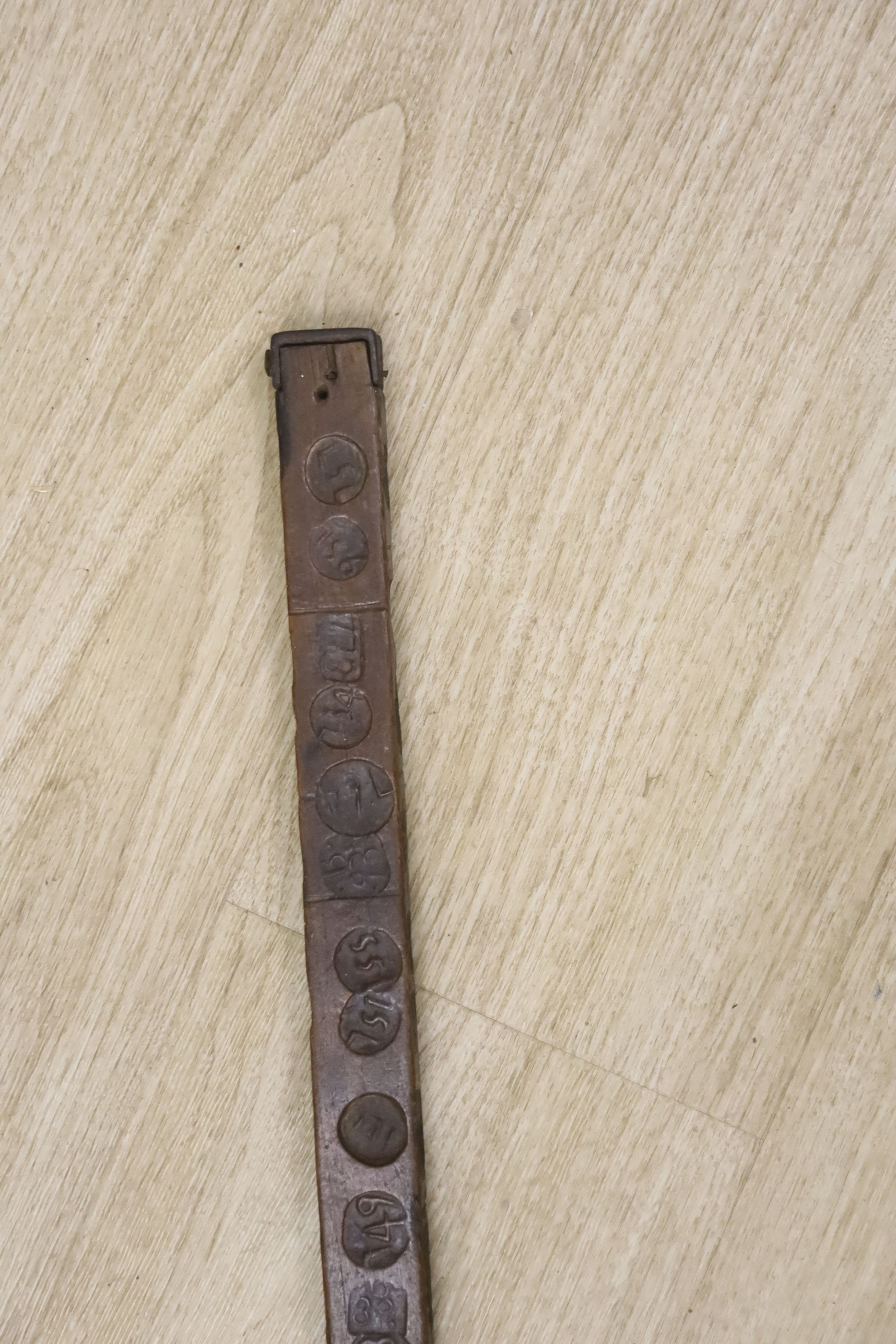 An unusual 18th/19th century rule/gauge or tally stick with impressed numerals, 26cm long